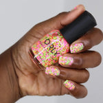 Bikini Bottoms Nail Lacquer is a vibrant starry topper featuring neon orange stars with neon pink and green dots for a playful, multi-dimensional look.