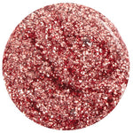 Frost Smitten Nail Lacquer is a lustrous rose gold glitter with mauve undertones, offering a dazzling, full-coverage finish that captures light beautifully.