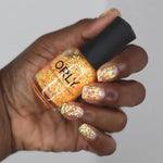 Hi, Bye - Nail Lacquer is a vibrant neon orange and yellow blend that evokes the warmth of a golden sunset. Its lively hue captures the essence of a sunlit horizon.
